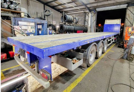 Flatbed trailer in a workshop at night during on-site training